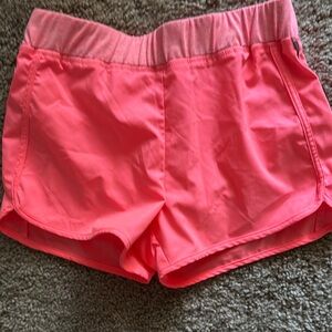 Vibrant Pink Athletic Shorts with Moisture-Wicking Fabric